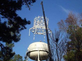 Placing apparatus on water tower Placing apparatus on water tower